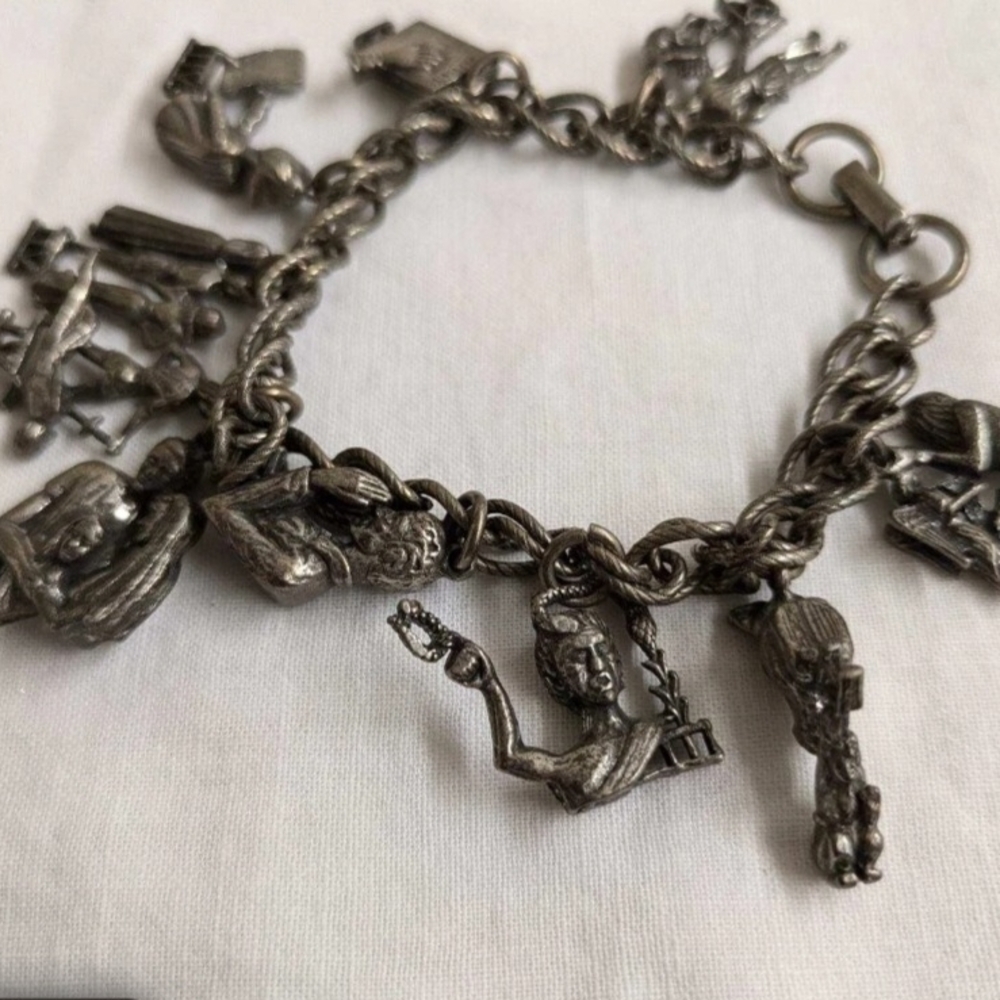 Vtg. silverplate? chain charm bracelet, 10 images, religious themed.